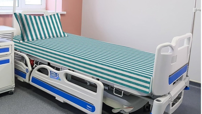 Hospital bed sheets manufactured for hygiene and durability by Karuna Textiles
